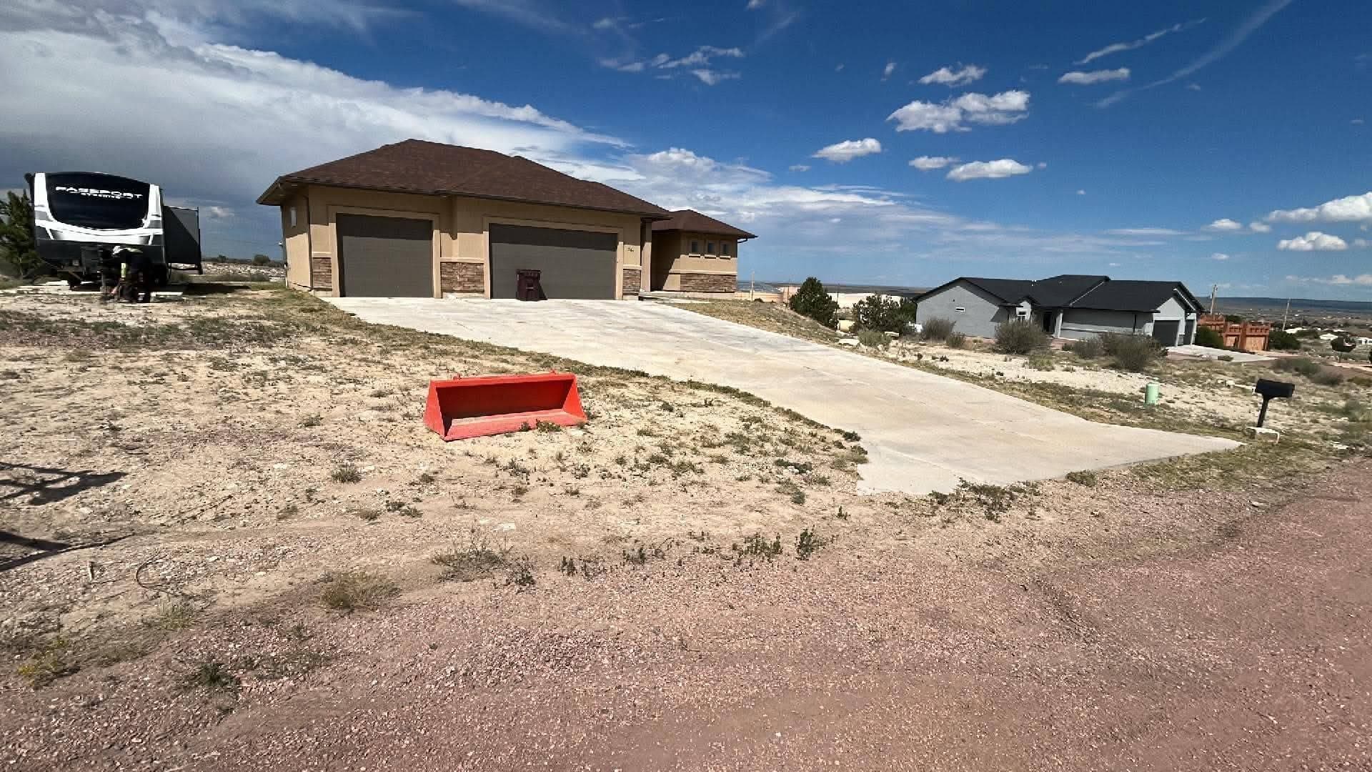 Newly poured concrete driveway on residential lot